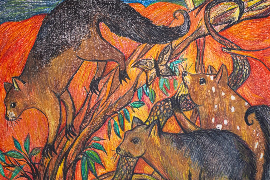 Colorful drawing of three large, brown, cat-like animals with long tails climbing on tree branches. The background features vivid orange and red hues, with green leaves adding contrast. The style is bold and dynamic with expressive lines.