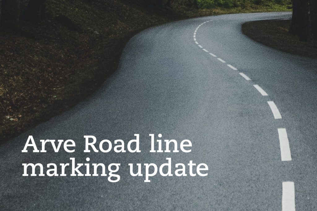 A winding road with fresh white line markings curves through a forested area. The text Arve Road line marking update is displayed on the left side of the image.