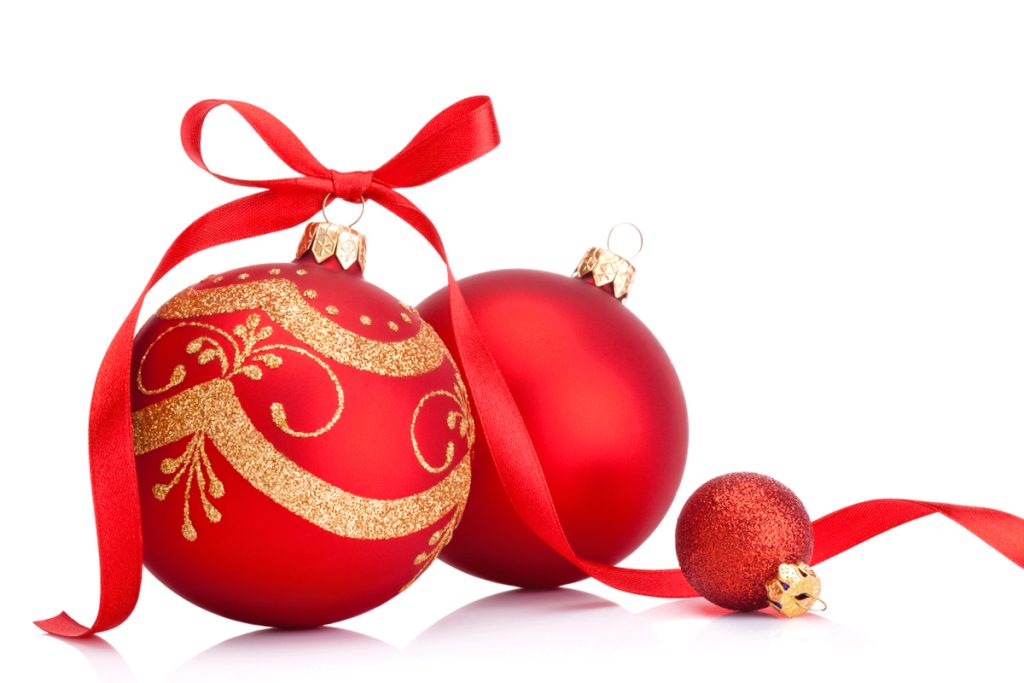 Three red Christmas ornaments. Two large ones, one with gold glitter swirls and a red bow, and a small sparkly one. All have golden caps and are set against a white background.
