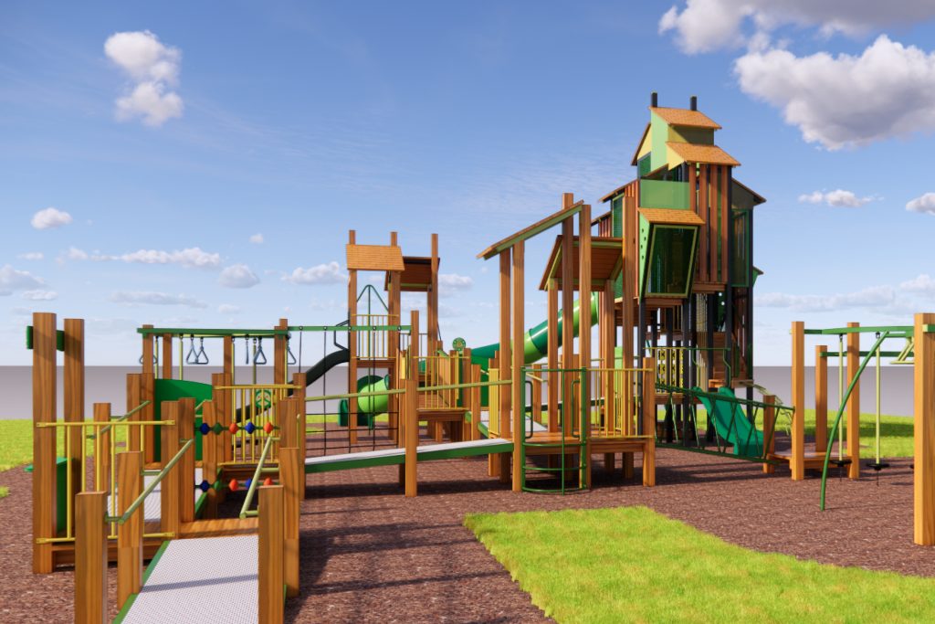 A colorful wooden playground features slides, climbing structures, and swings. The tallest structure resembles a treehouse. The equipment is surrounded by grass and mulch, with a clear blue sky overhead.