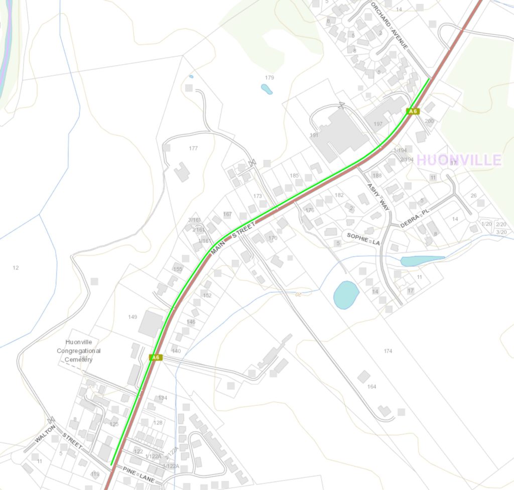 Map showing a section of Huonville with a highlighted green route on Main Street. Several road names are visible, along with buildings, natural features, and a notable congregation locale.