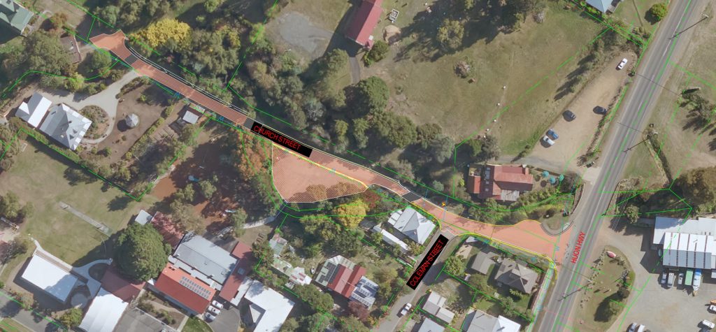 Aerial view of a suburban area with houses surrounded by trees. Theres a small road running through the center with two marked areas labeled as Culvert 1 and Culvert 2. Green lines indicate property boundaries.