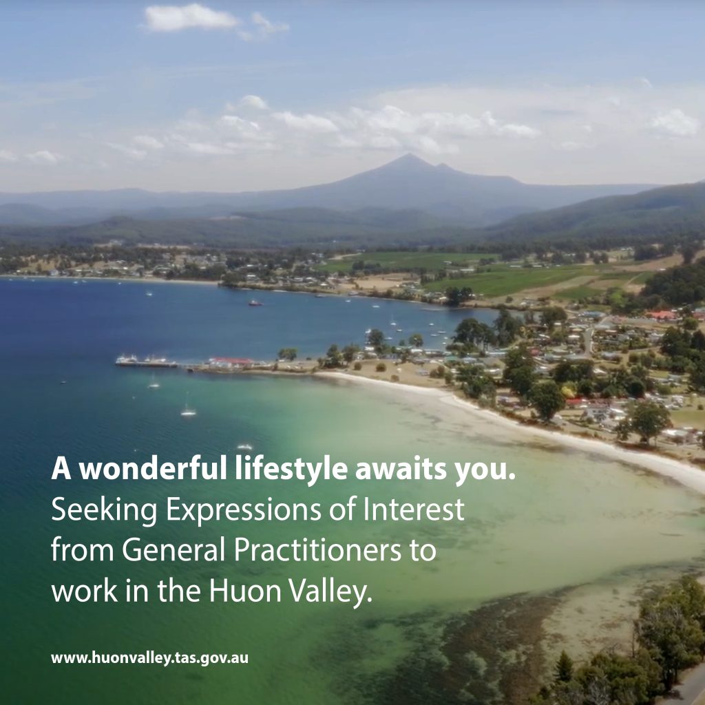 A scenic view of Huon Valleys coastline with lush greenery and distant mountains. The text reads, A wonderful lifestyle awaits you. Seeking Expressions of Interest from General Practitioners to work in the Huon Valley. Website: www.huonvalley.tas.gov.au.