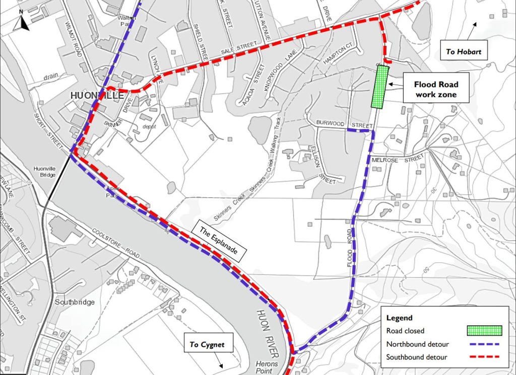 Map showing Huonville with road closures and detours due to flood work. Red dashed lines indicate closed roads, blue lines mark the northbound detour, and purple lines show the southbound detour. Flood work zone is highlighted in green.
