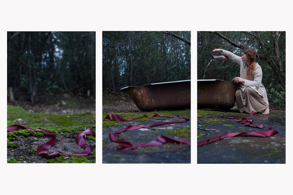 Triptych image: Left: Red ribbons lie on mossy ground. Middle: An old, rusty bathtub sits in a forest clearing. Right: A person with long red hair, wearing a beige outfit, sits by the bathtub, extending a hand into it.