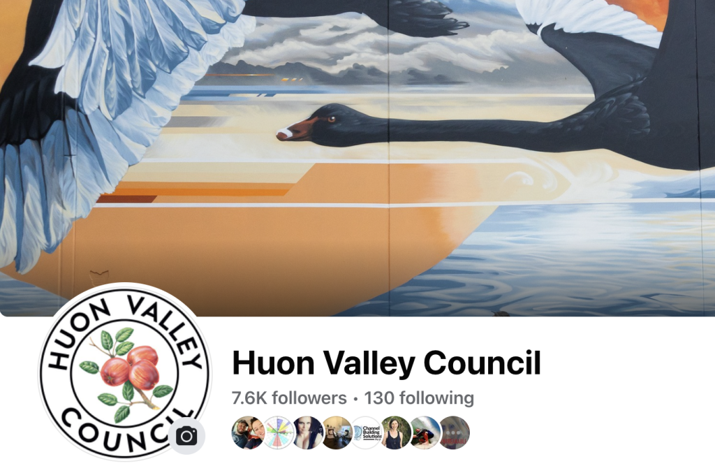 Facebook cover photo for Huon Valley Council featuring an artwork of black swans flying over water. The councils logo shows apples, leaves, and a circle with the text HUON VALLEY COUNCIL. The page has 7.6K followers and 130 following.