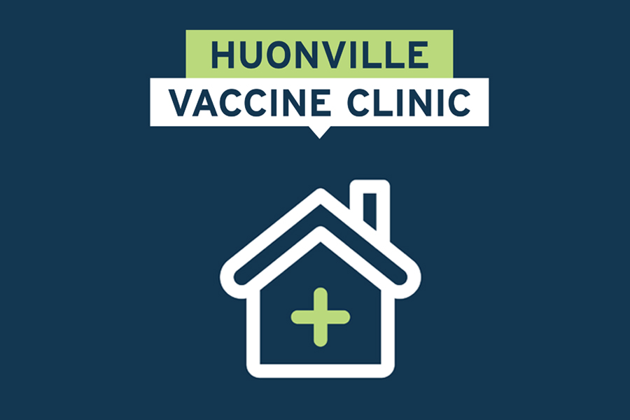 Illustration of a house with a medical cross in the center on a dark blue background. Above the house, text reads HUONVILLE VACCINE CLINIC in white and green.