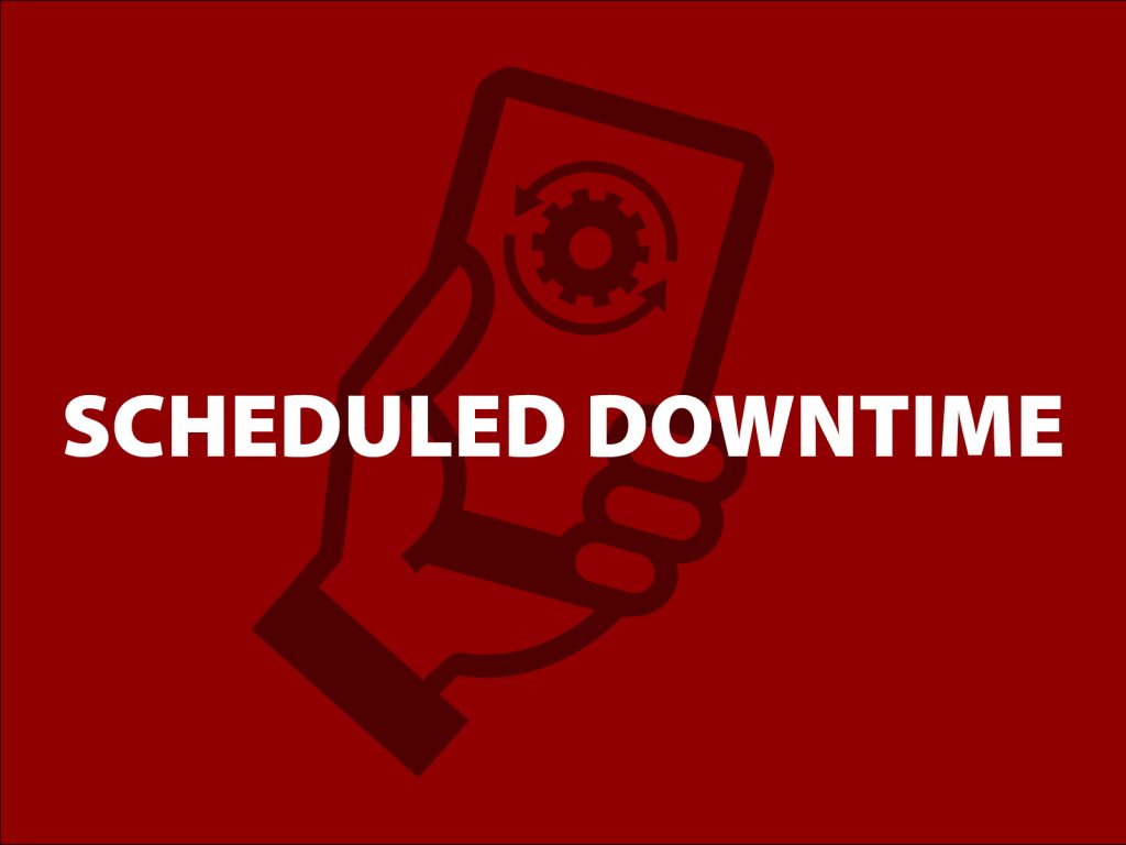 Image of a hand holding a smartphone with a gear symbol on the screen. The background is red, and the words Scheduled Downtime are prominently displayed in white across the image.