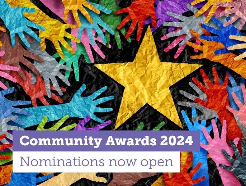 Colorful paper-cut hands surround a large yellow star on a textured background. A purple and white banner at the bottom reads, Community Awards 2024 - Nominations now open.