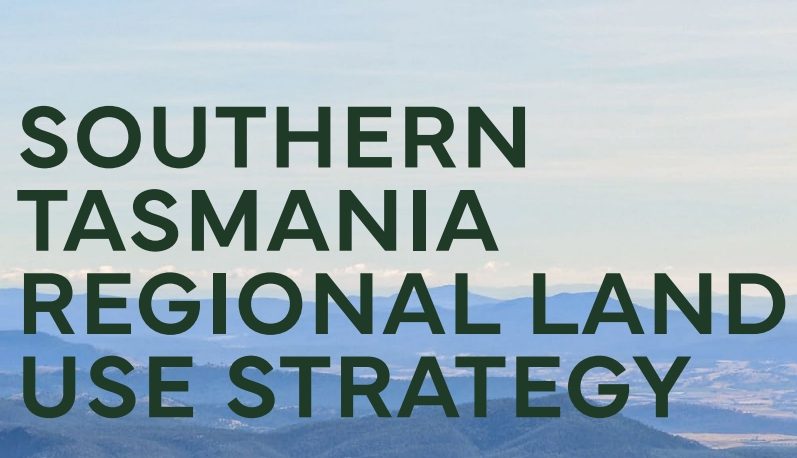 Text reads Southern Tasmania Regional Land Use Strategy over a background of blue sky and distant hills.