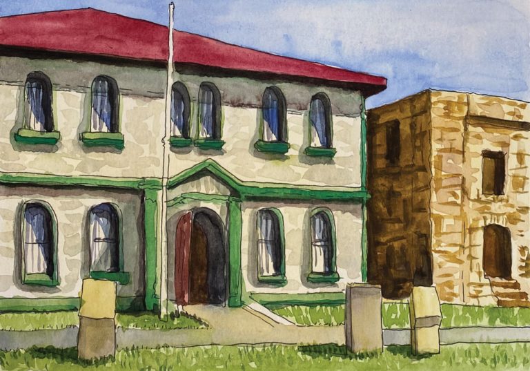 Watercolor painting of a two-story building with a red roof and green trim, featuring arched windows and an arched entryway; a stone building stands to the right. Grass and a fence are in the foreground.