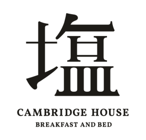 Black kanji character above the words CAMBRIDGE HOUSE BREAKFAST AND BED on a light background, with the text arranged in two lines below the character.