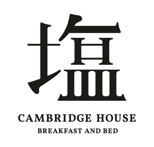 Black Chinese character above the text CAMBRIDGE HOUSE BREAKFAST AND BED on a light background; the design combines Asian and Western typography.