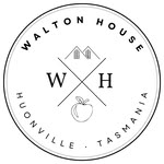 Black and white circular logo for Walton House, Huonville, Tasmania. It features the letters W and H, a house icon above, and an apple icon below, all within a double-line border.