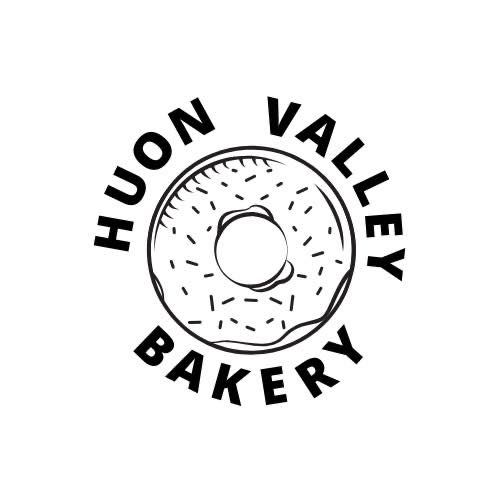 Black and white logo featuring a donut with sprinkles in the center. The words Huon Valley Bakery are arranged in a circular layout around the donut graphic.