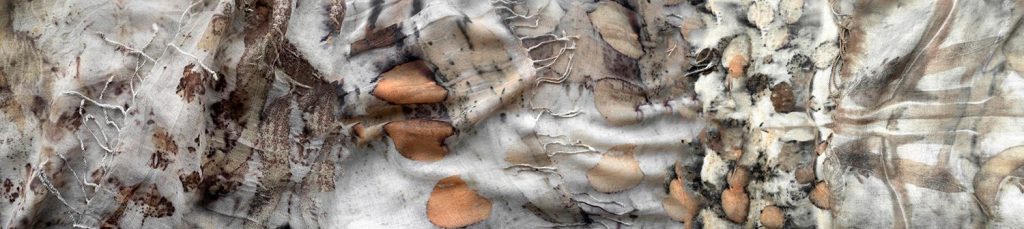 A close-up of three pieces of textured fabric, each with natural, earthy patterns in beige, brown, and gray tones, featuring leaf-like imprints, stitching, and organic shapes.