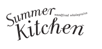 Black text on a white background that reads Summer Kitchen in large, stylized letters, with smaller text above Kitchen that says woodfired wholegrains.