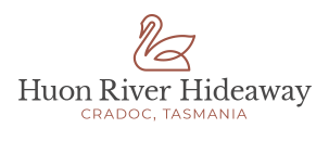 Logo with a simple line drawing of a swan above the words “Huon River Hideaway” and “Cradoc, Tasmania” in capital letters.