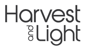The image shows the words Harvest and Light in large, bold, modern black font on a light gray background. The word and is written vertically between Harvest and Light.