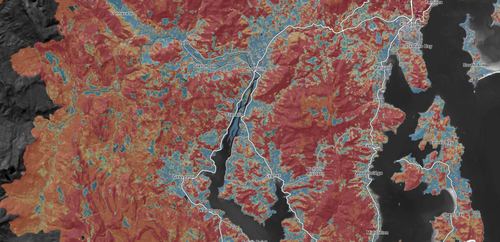 A detailed map shows land in shades of red, orange, and blue, intersected by white roads and black waterways; various coastal and inland locations are labeled, including towns and bays.