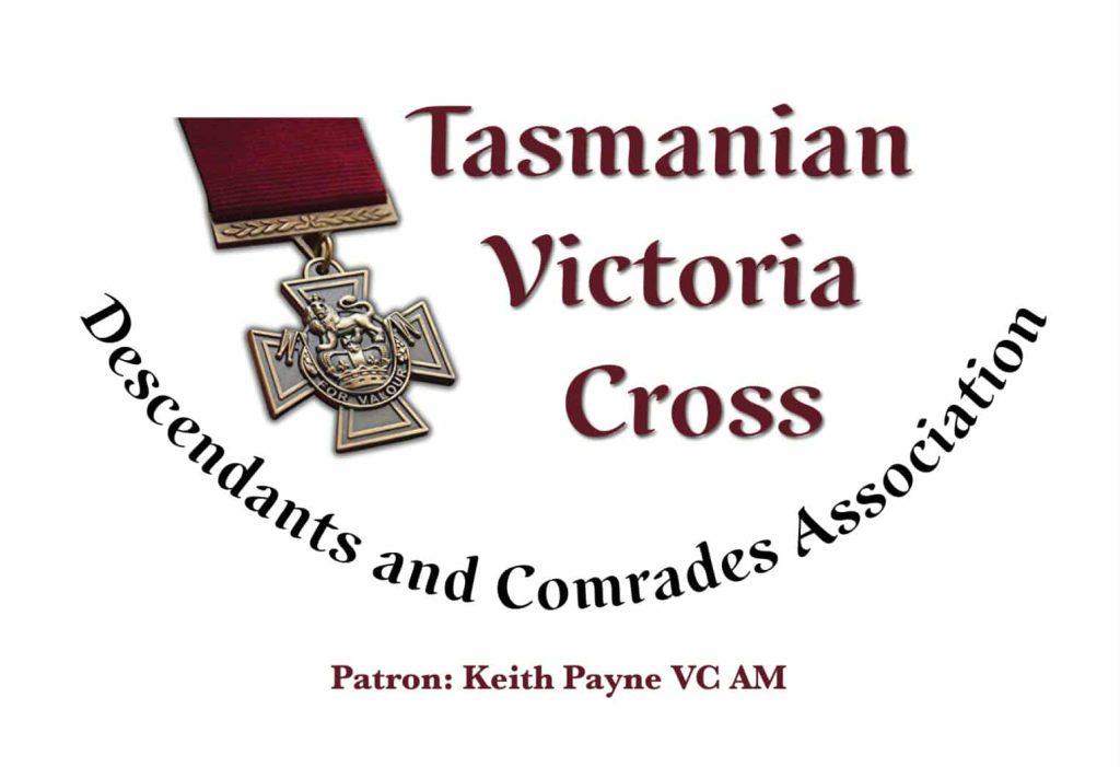 A Victoria Cross medal with a maroon ribbon, alongside the text: Tasmanian Victoria Cross Descendants and Comrades Association. Patron: Keith Payne VC AM.