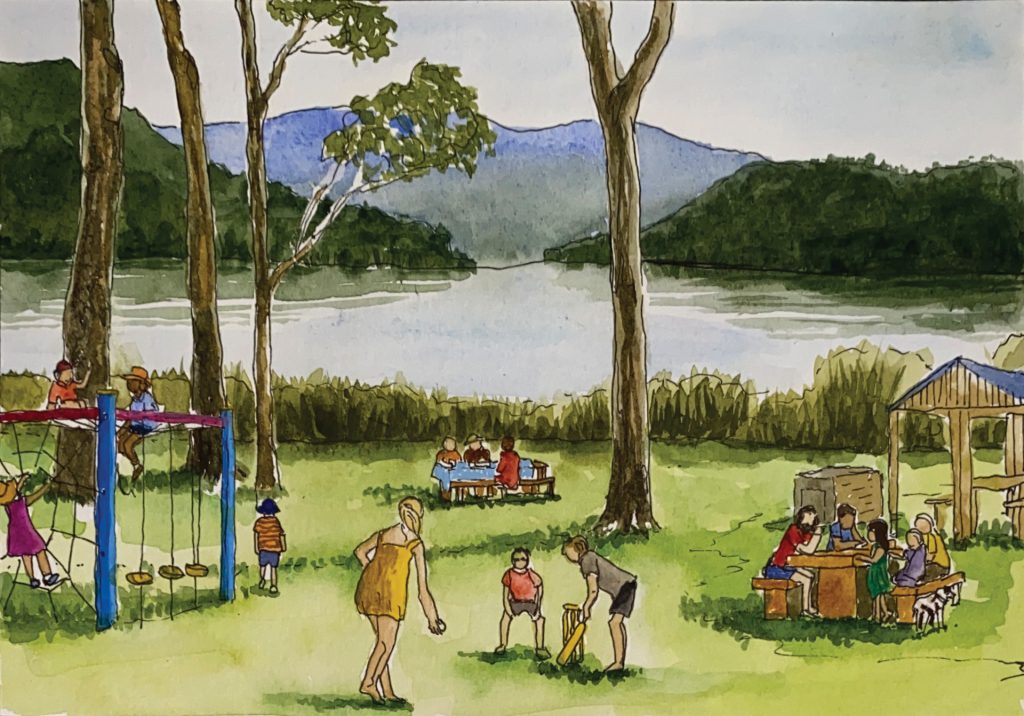 A park scene by a lake with children playing on swings and with a ball, adults sitting at picnic tables, and people gathered near a shelter. Mountains and trees are in the background.