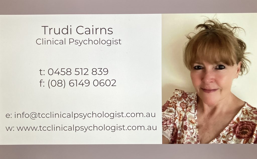 Business card for Trudi Cairns, Clinical Psychologist, with phone, fax, email, website info, and a portrait photo of her smiling, wearing a light floral top, with her hair tied up.